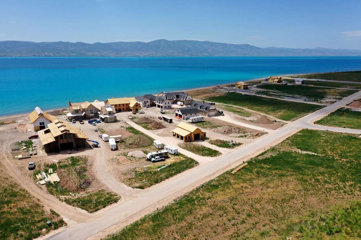 Homes are under construction on the east side of Bear Lake in Rich County on Wednesday. A new study reveals visitors to Bear Lake last summer pumped $48 million into the northern Utah region during more than a million days and nights of visitation.