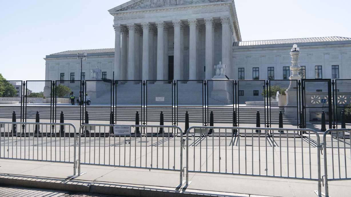 The Supreme Court is seen Thursday in Washington. The court Thursday limited how the nation's main anti-air pollution law can be used to reduce carbon dioxide emissions from power plants.