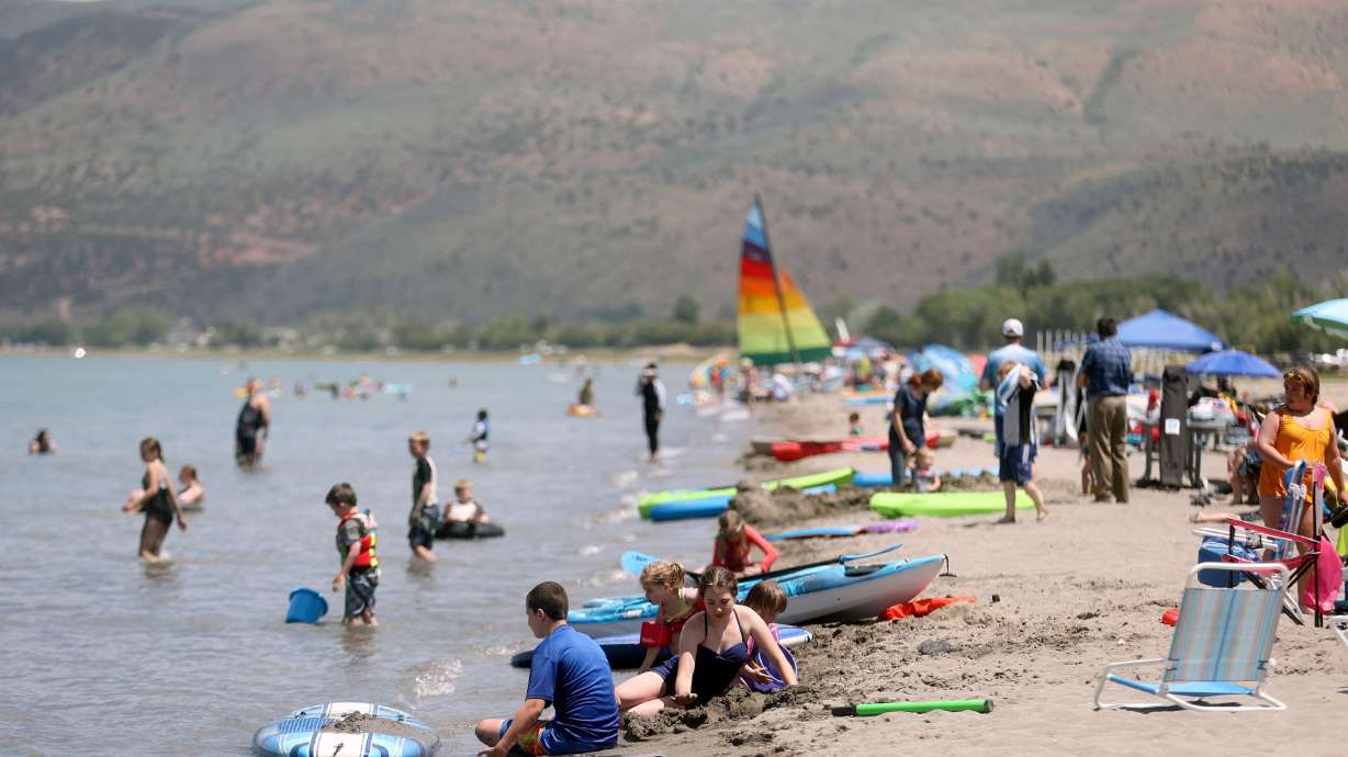 People recreate at Rendezvous Beach on the south shore of Bear Lake in Rich County on June 29. The boat ramp for Rendezvous Beach is closed and has been closed for the last two seasons.