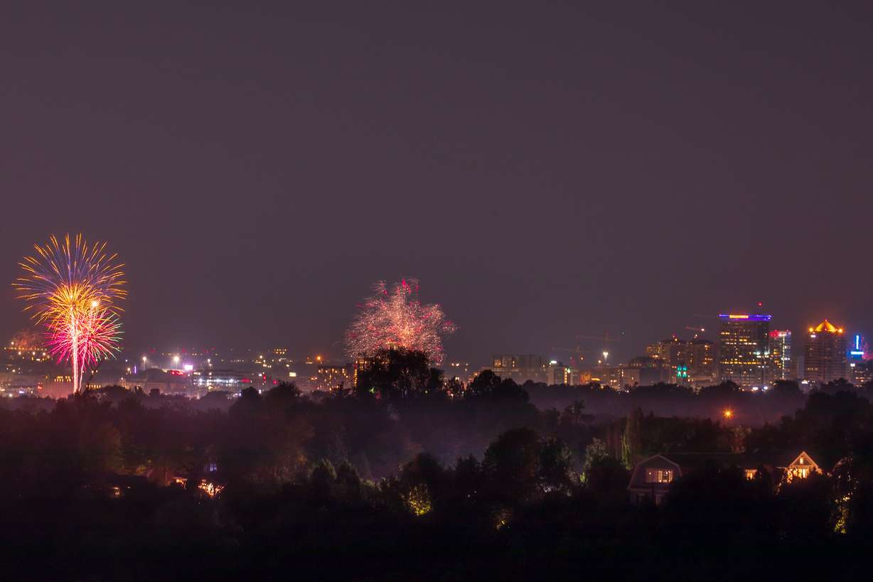 Fireworks launched during a Pioneer Day celebration at Liberty Park viewed from Tanner Park in Salt Lake City on Saturday, July 24, 2021.