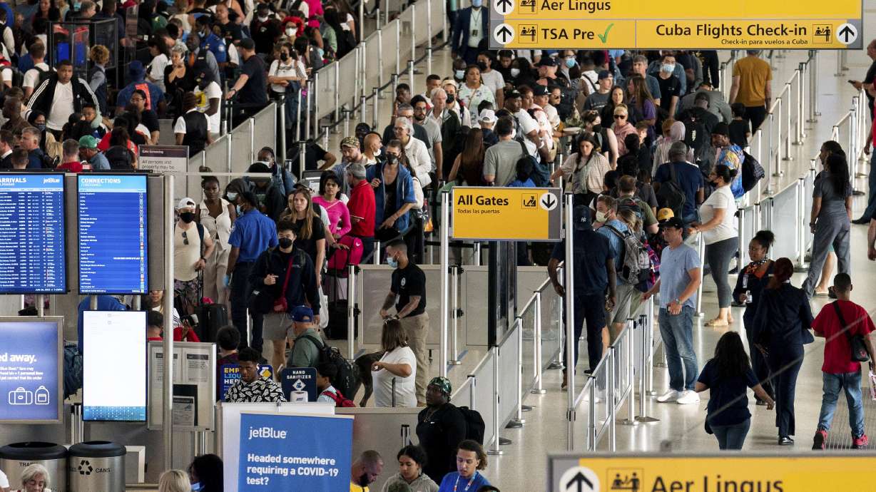 People wait in a TSA line at the John F. Kennedy International Airport on Tuesday in New York.