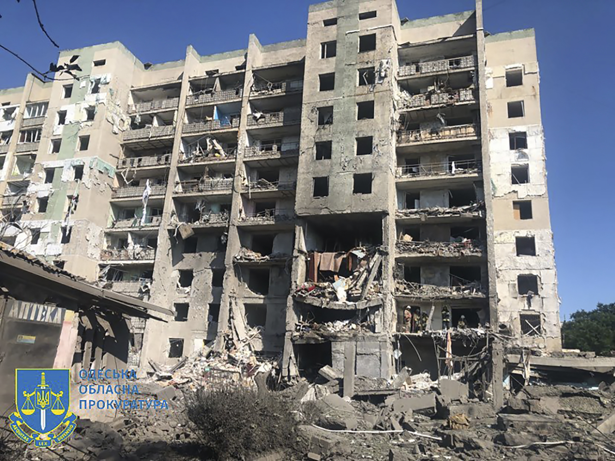 In this photo provided by the Odesa Regional Prosecutor's Office, a damaged residential building is seen in Odesa, Ukraine, early Friday, following Russian missile attacks. Ukrainian authorities said Russian missile attacks on residential buildings in the port city of Odesa have killed more than a dozen people.