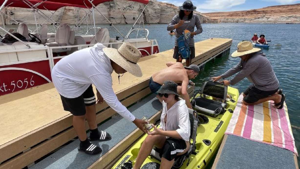 A pair of kayakers return from their journey through Antelope Point, Page, Ariz.