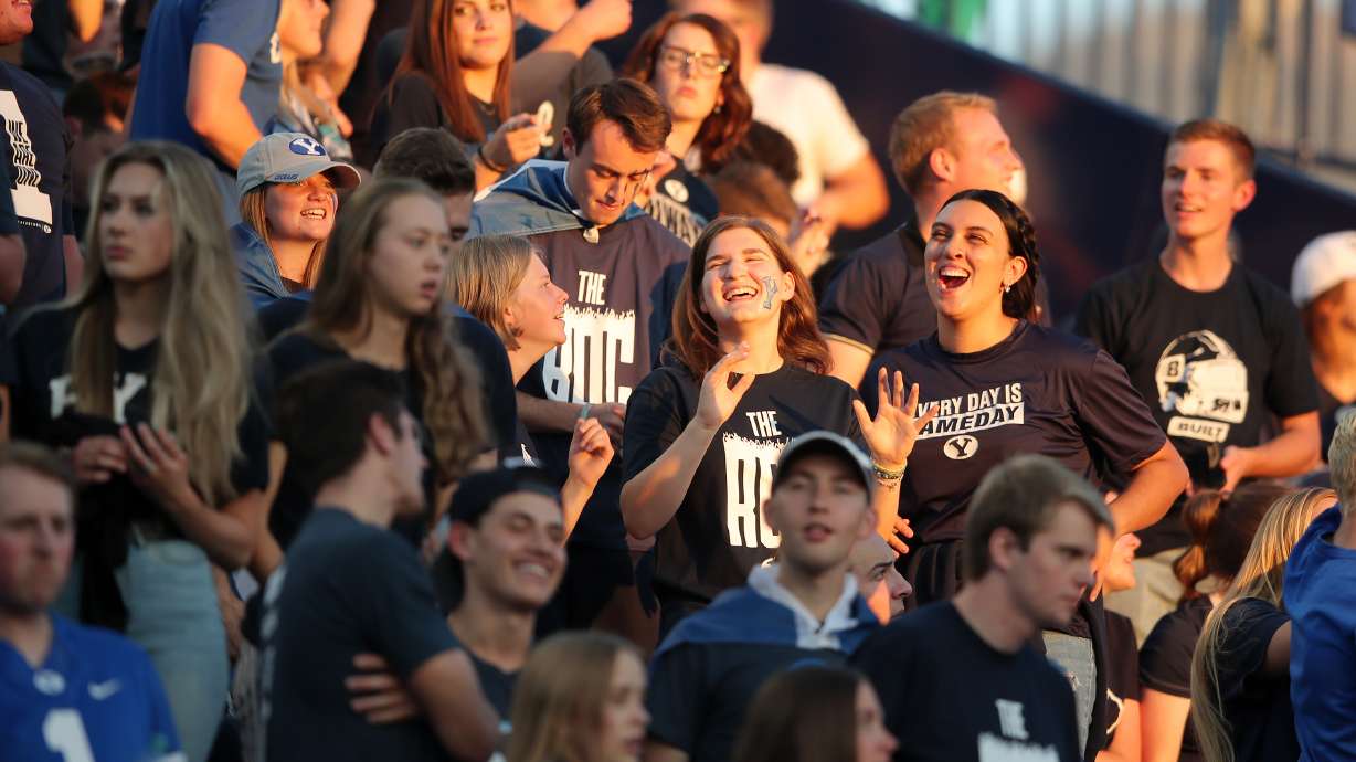 Fans sing and dance prior to watching BYU and USF play a college football game at LaVell Edwards Stadium in Provo on Sept. 25, 2021.
