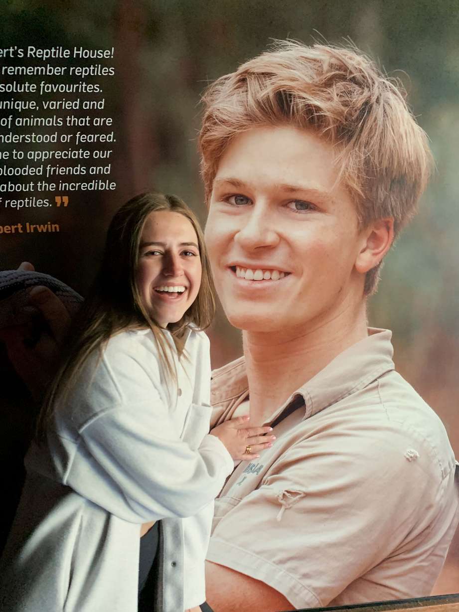 Megan Grass poses with a poster of Robert Irwin while visiting the Australia Zoo with her family in Beerwah, Australia, on June 12. Grass posted a TikTok video, that has gone viral, of her asking Robert Irwin, son of “The Crocodile Hunter” Steve Irwin, for his number.