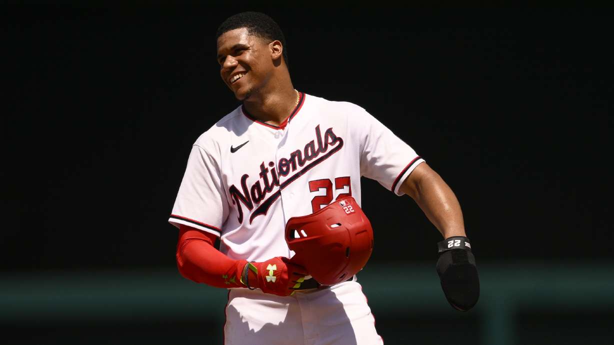 Washington Nationals' Juan Soto smiles as he stands on second during the fourth inning of a baseball game against the Miami Marlins, Sunday, July 3, 2022, in Washington.