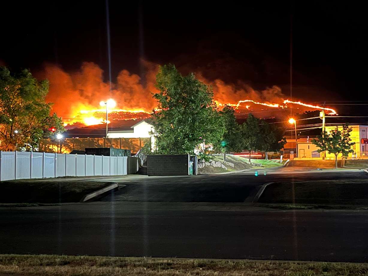 Flames can be seen burning on the hillside above Centerville Monday.