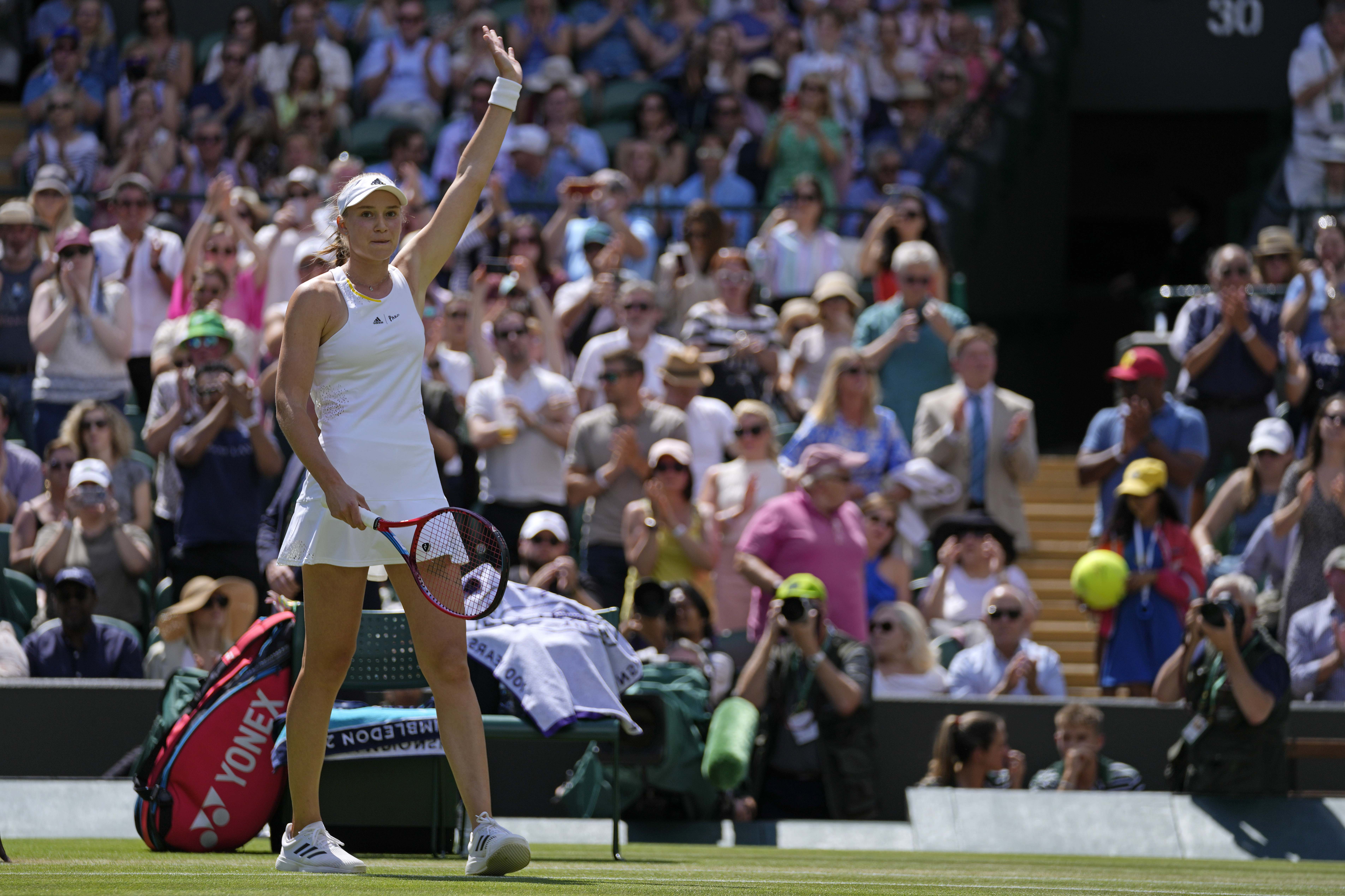Kazakhstan's Elena Rybakina celebrates after beating Croatia's Petra Martic in a women's singles fourth round match on day eight of the Wimbledon tennis championships in London, Monday, July 4, 2022. 
