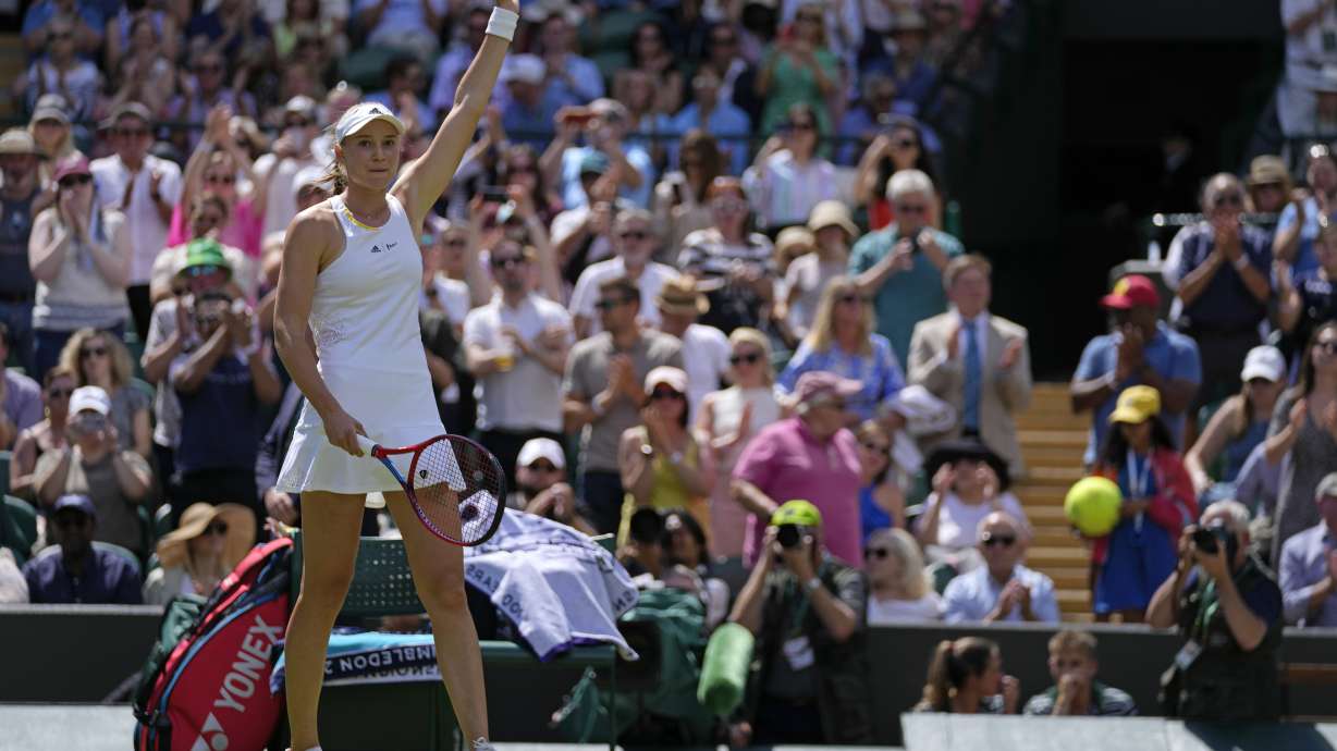 Kazakhstan's Elena Rybakina celebrates after beating Croatia's Petra Martic in a women's singles fourth round match on day eight of the Wimbledon tennis championships in London, Monday, July 4, 2022.