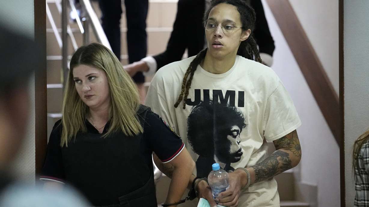 WNBA star and two-time Olympic gold medalist Brittney Griner is escorted to a courtroom for a hearing, in Khimki just outside Moscow, Russia, Friday, July 1, 2022. U.S. basketball star Brittney Griner is set to go on trial in a Moscow-area court Friday. The proceedings that are scheduled to begin Friday come about 4 1/2 months after she was arrested on cannabis possession charges at an airport while traveling to play for a Russian team.