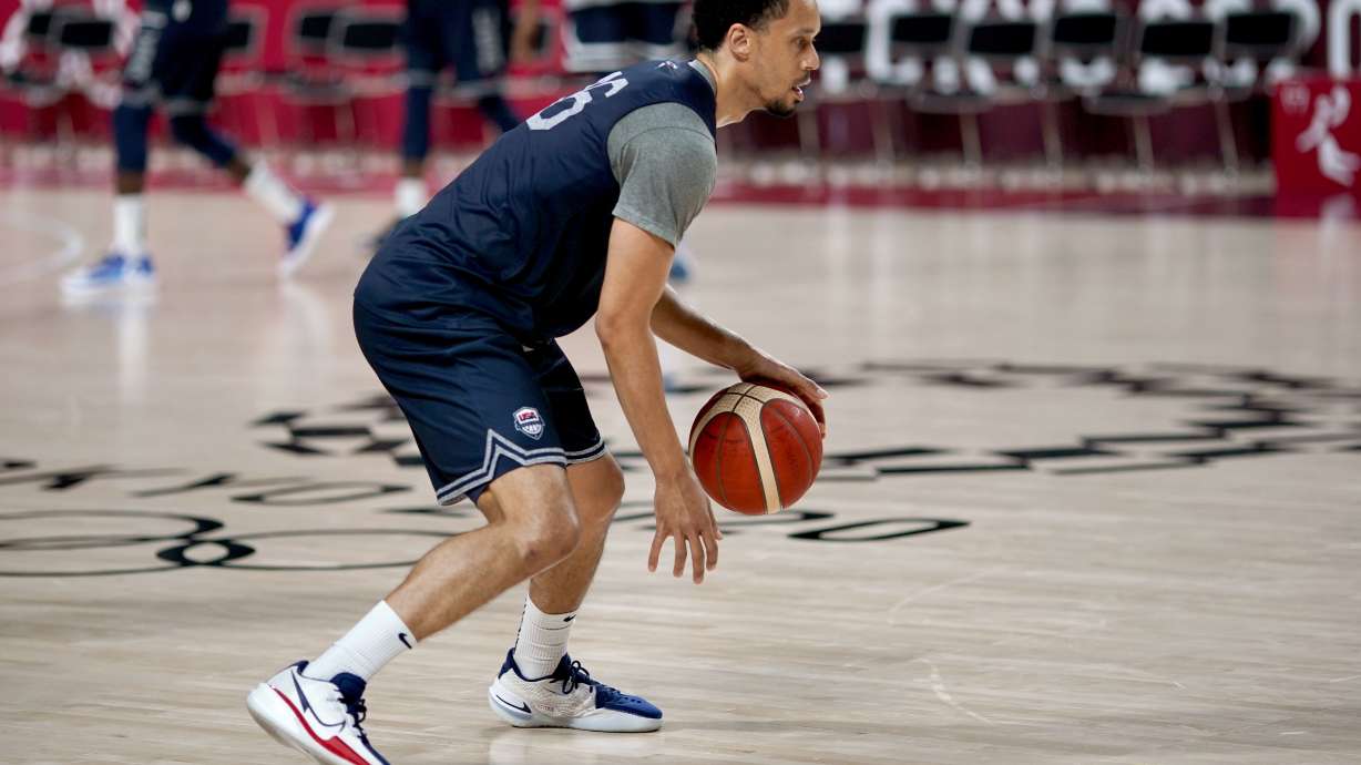 FILE - United States' John Jenkins dribbles the ball during a men's basketball practice at the Tokyo 2020 Olympics, in Saitama, Japan, Thursday, July 22, 2021. Jenkins and the U.S. finished first-round World Cup qualifying against Cuba on Monday, July 4, 2022, in Havana.
