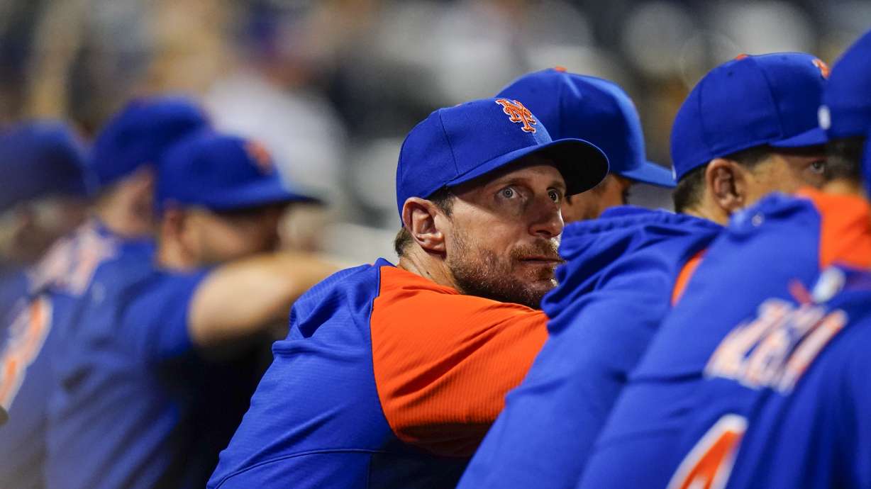 New York Mets pitcher Max Scherzer watches during the eighth inning of a baseball game against the Milwaukee Brewers, Tuesday, June 14, 2022, in New York.