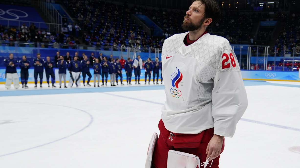 FILE - Russian Olympic Committee goalkeeper Ivan Fedotov (28) skates across the ice to receive his silver medal after Finland defeated Russian Olympic Committee in the men's gold medal hockey game at the 2022 Winter Olympics, Sunday, Feb. 20, 2022, in Beijing. The future of Philadelphia Flyers goaltending prospect Ivan Fedotov is uncertain after he was involved in an unexpected incident while leaving a hockey rink in St. Petersburg, Russia. St. Petersburg-based news website Fontanka on Friday, July 1, 2022, reported Fedotov was picked up outside a rink in the city by law enforcement on suspicion of evading military service and instructed to go to an enlistment office.