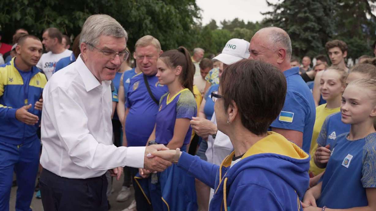 International Olympic Committee President Thomas Bach shakes hands with Ukrainian Olympic athletes in Kyiv on Sunday. Bach visited the war-torn country at the invitation of the National Olympic Committee of Ukraine, before meeting with President Volodymyr Zelenskyy.
