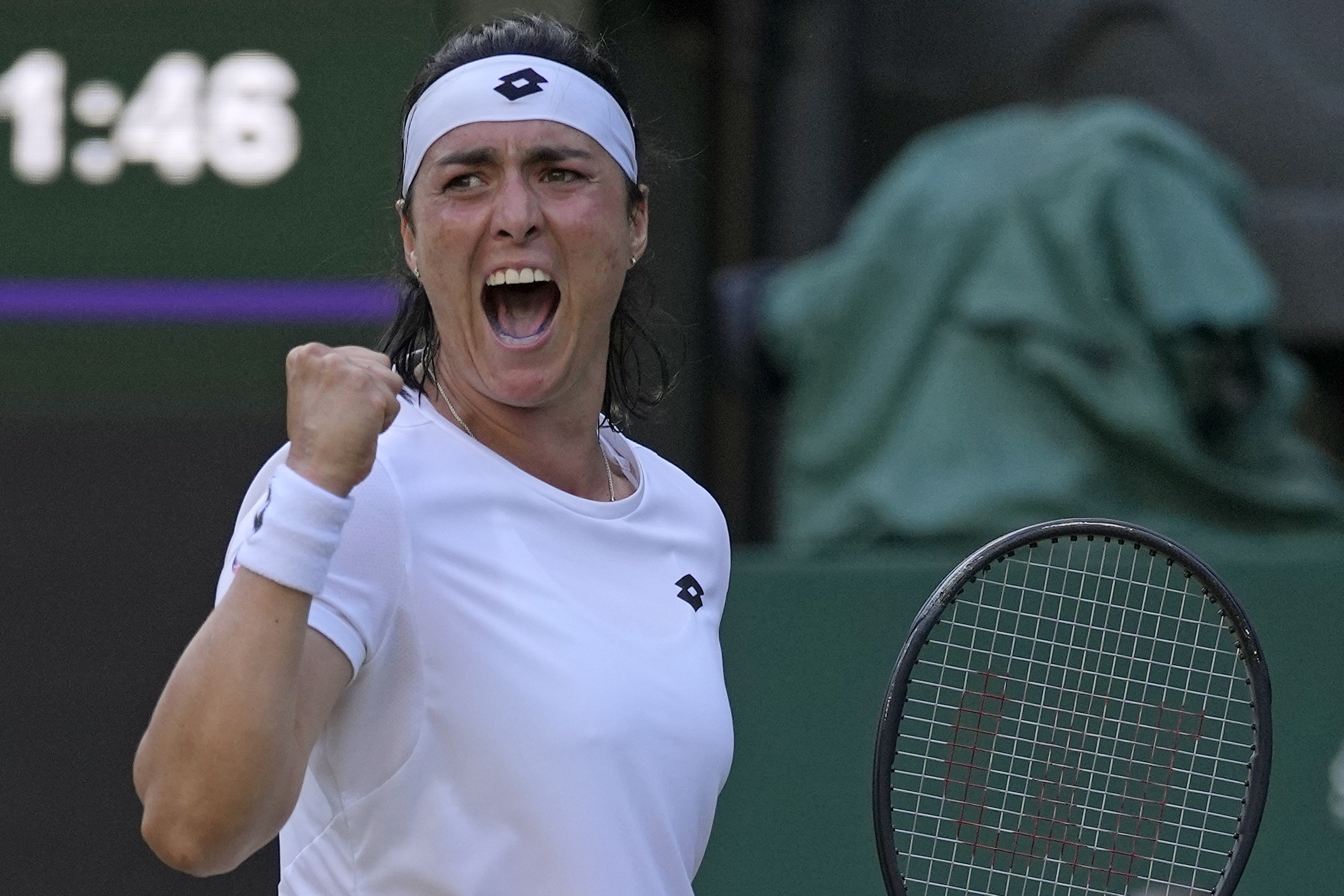 Tunisia's Ons Jabeur celebrates after winning a point against Marie Bouzkova of the Czech Republic in a women's singles quarterfinal match on day nine of the Wimbledon tennis championships in London, Tuesday, July 5, 2022.