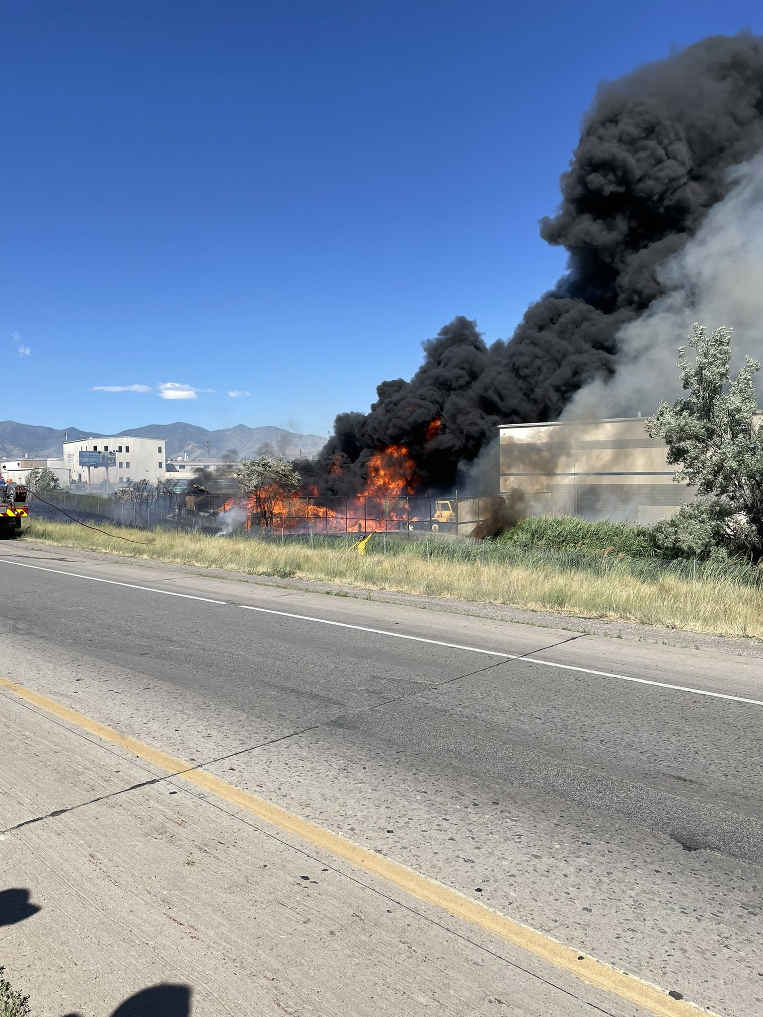 Authorities closed a portion of I-215 a second time Wednesday due to a grass fire.
