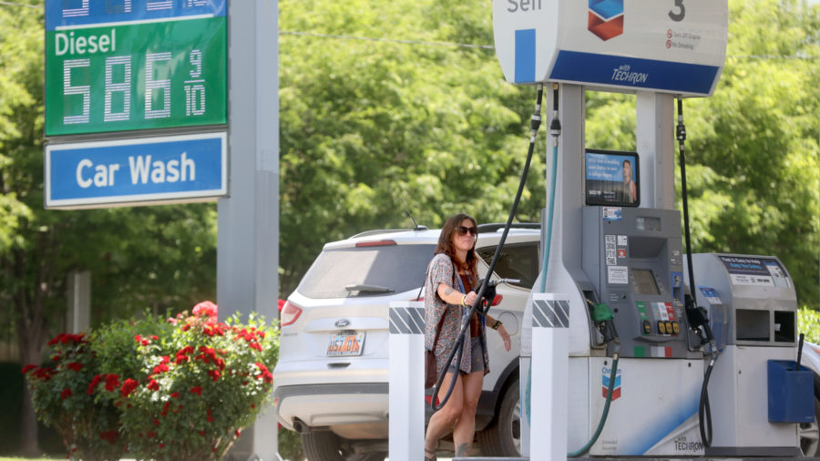 Gypsy Cottam pumps gas even as prices rose to more than $5 a gallon at a Chevron in Salt Lake City on Thursday, June 9. The average price of gas in Utah dropped 11 cents from last week, according to a AAA report on Monday.