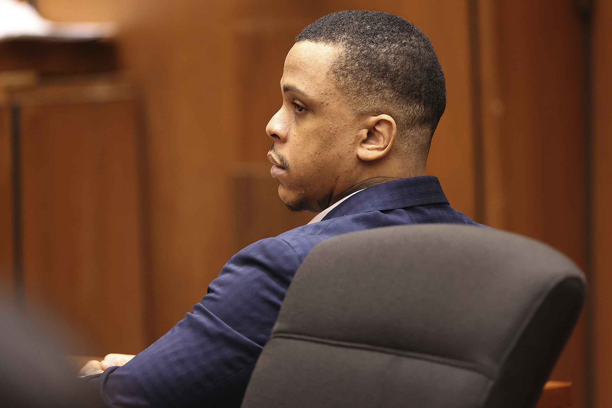 Defendant Eric Holder listens during opening statements in his murder trial, June 15, at Los Angeles Superior Court in Los Angeles. Holder, 32, was found guilty of first-degree murder for the 2019 fatal shooting of rapper Nipsey Hussle.