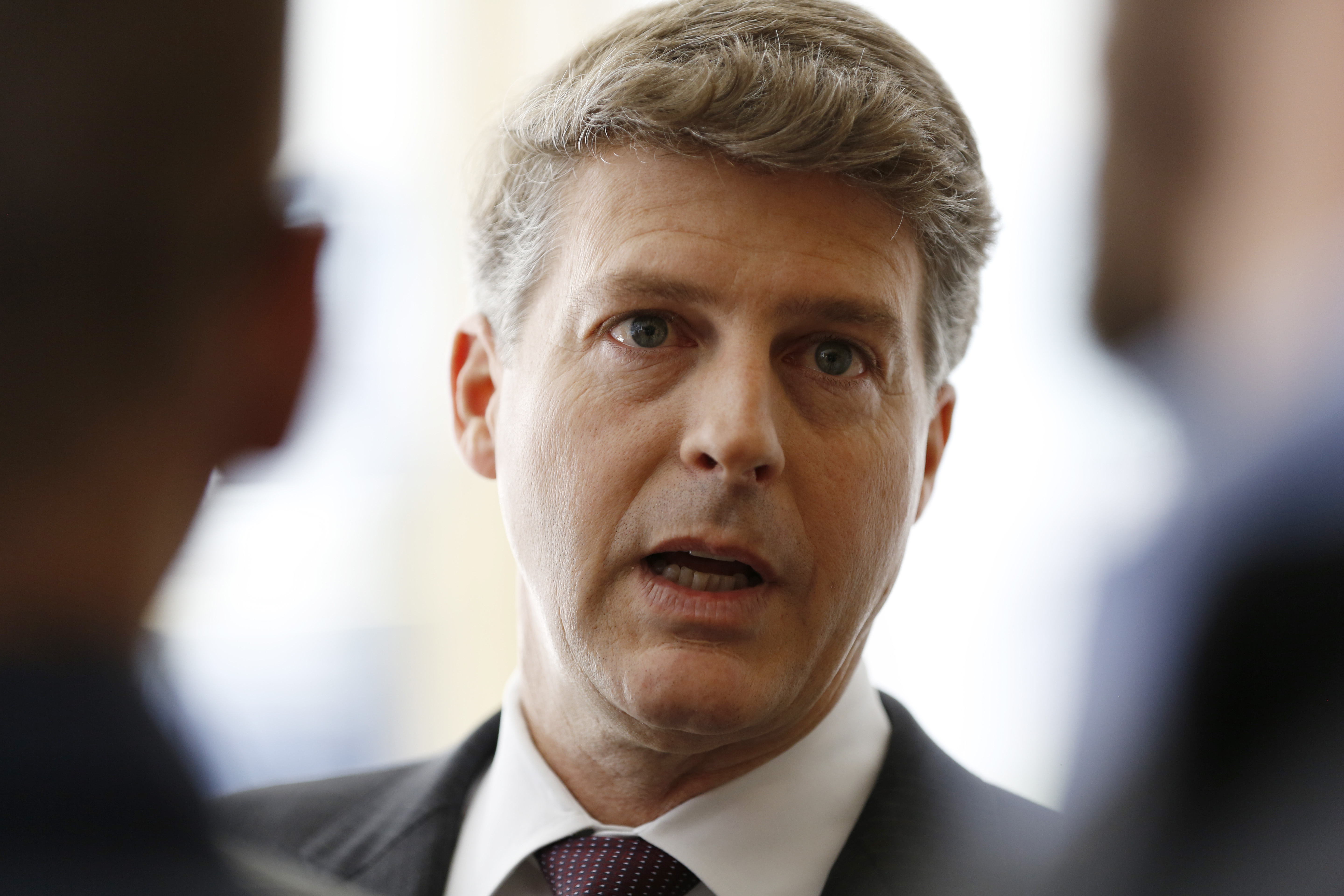 FILE - New York Yankees owner Hal Steinbrenner stops to talk to the media before attending a meeting of Major League Baseball's executive committee on May 18, 2016, in New York. Steinbrenner realizes there is a chance the price may be going up to sign Aaron Judge to a long-term contract after the star slugger’s outstanding first half. Judge turned down an eight-year contract worth $230.5 million to $234.5 million, cutting off talks ahead of the April 8 opener and saying he wouldn’t negotiate again until after the season. 