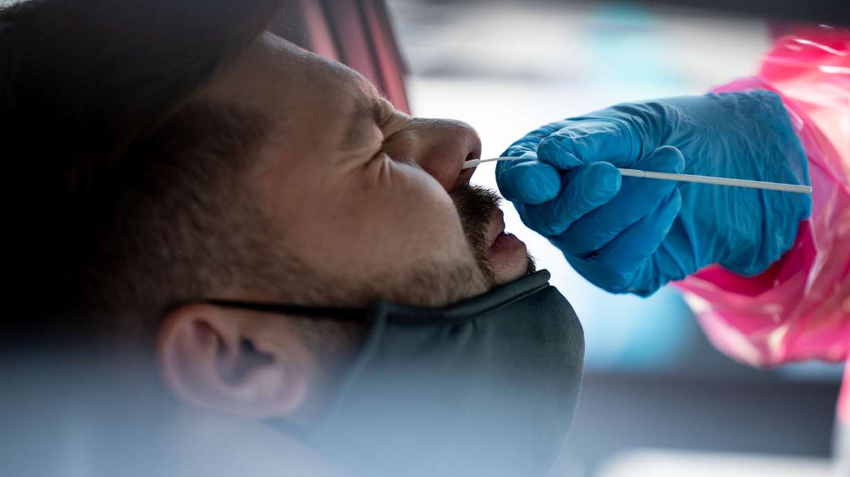 Tristan McGraw gets tested for COVID-19 at a NOMI Health drive-thru test site in West Valley City on June 10. The omicron subvariant known as BA.5 now accounts for almost 54% of the county’s COVID-19 cases, according to the latest estimates by the Centers for Disease Control and Prevention.