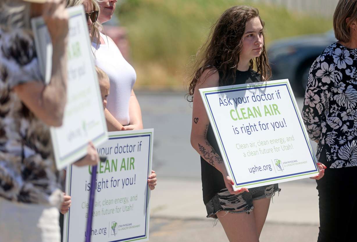 Dylan Henderson, who used to live near Stericycle, holds a sign at a Utah Physicians for a Healthy Environment press conference in North Salt Lake on Wednesday to mark the recent closure of Stericycle’s medical waste incinerator.