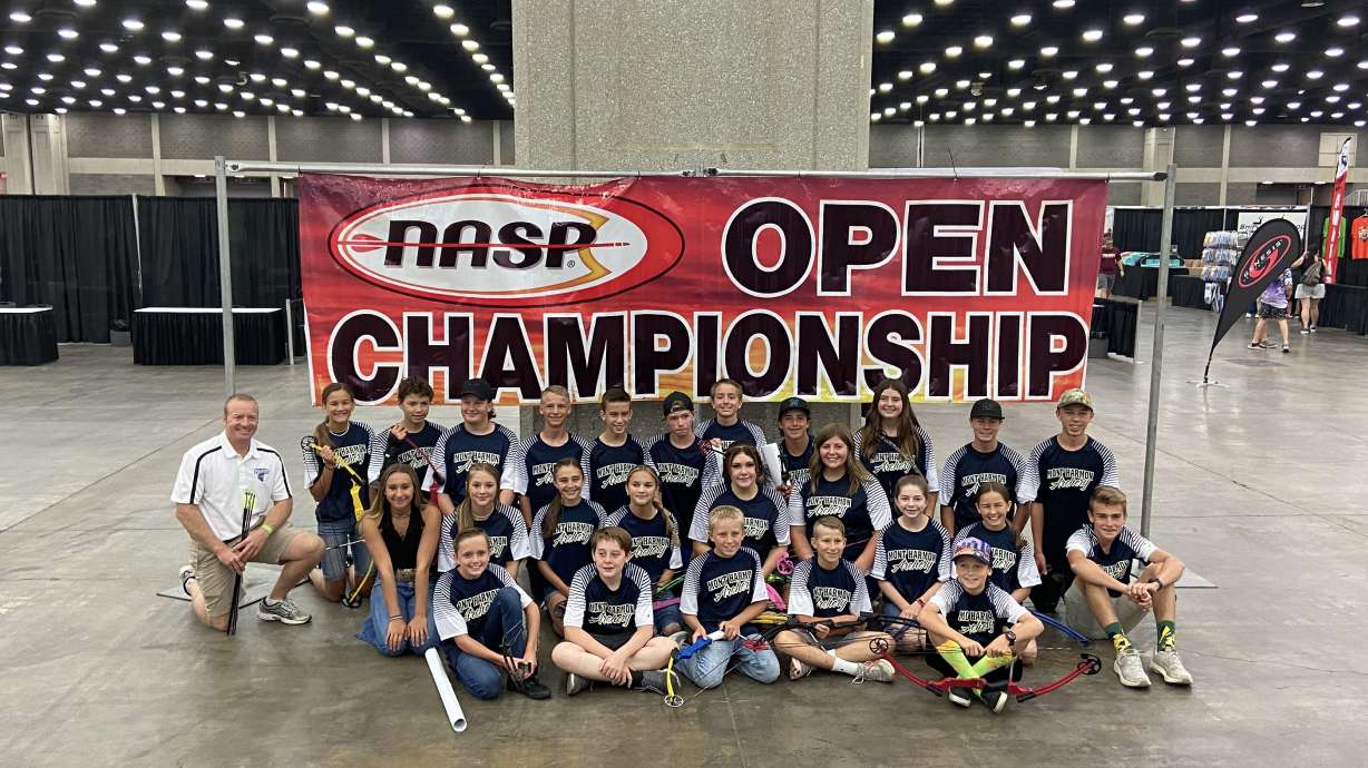 Coach Tom Lasslo, far left, poses for a picture with his archery team during the 2022 World Open Archery Championship in Lousiville, Kentucky, on June 25. The team placed second in the competition.