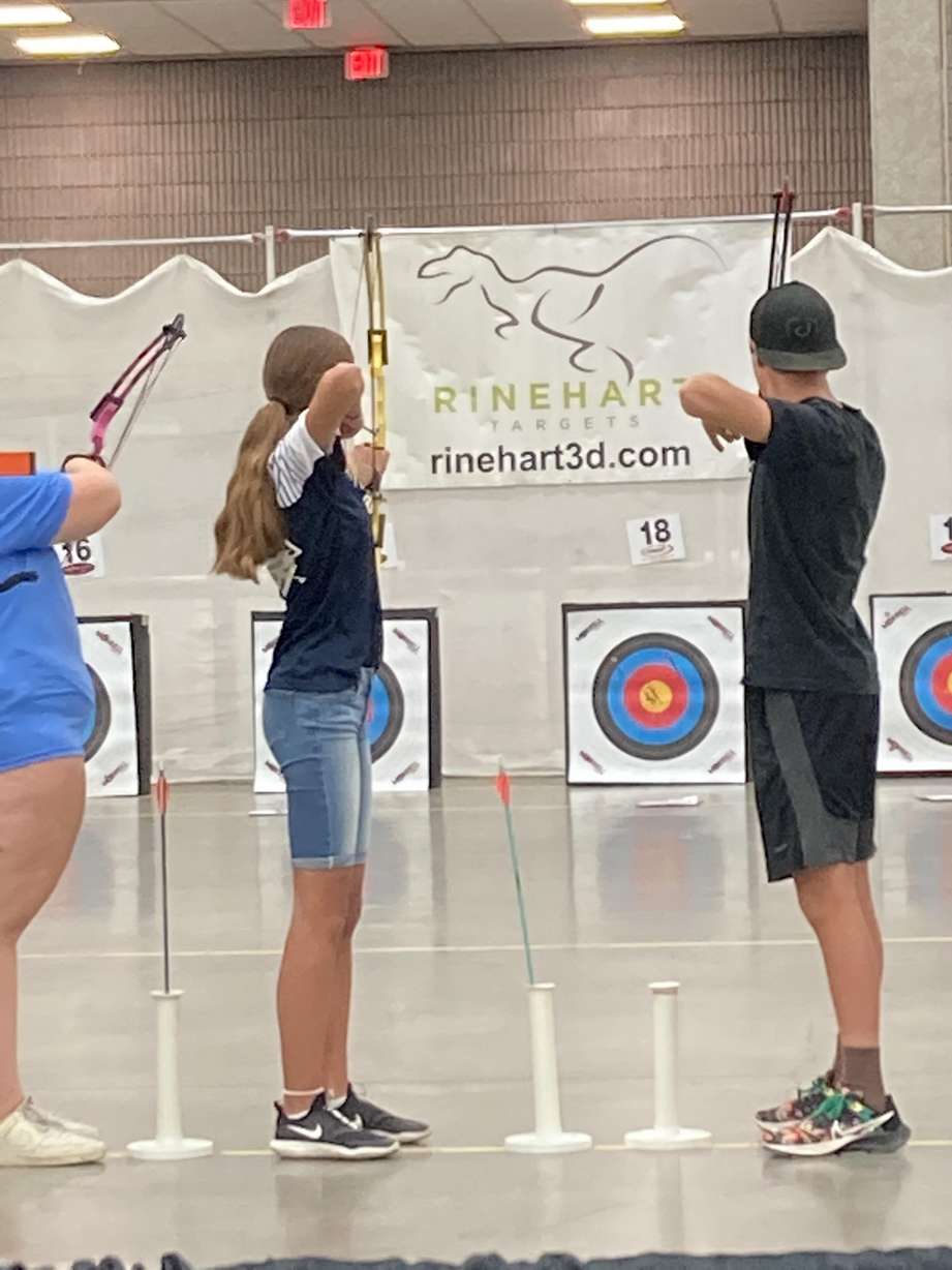 Kenzie Morgan, a student at Mont Harmon Middle School, aims her bow during competition at the 2022 World Open Archery Championship in Lousiville, Kentucky, on June 25.