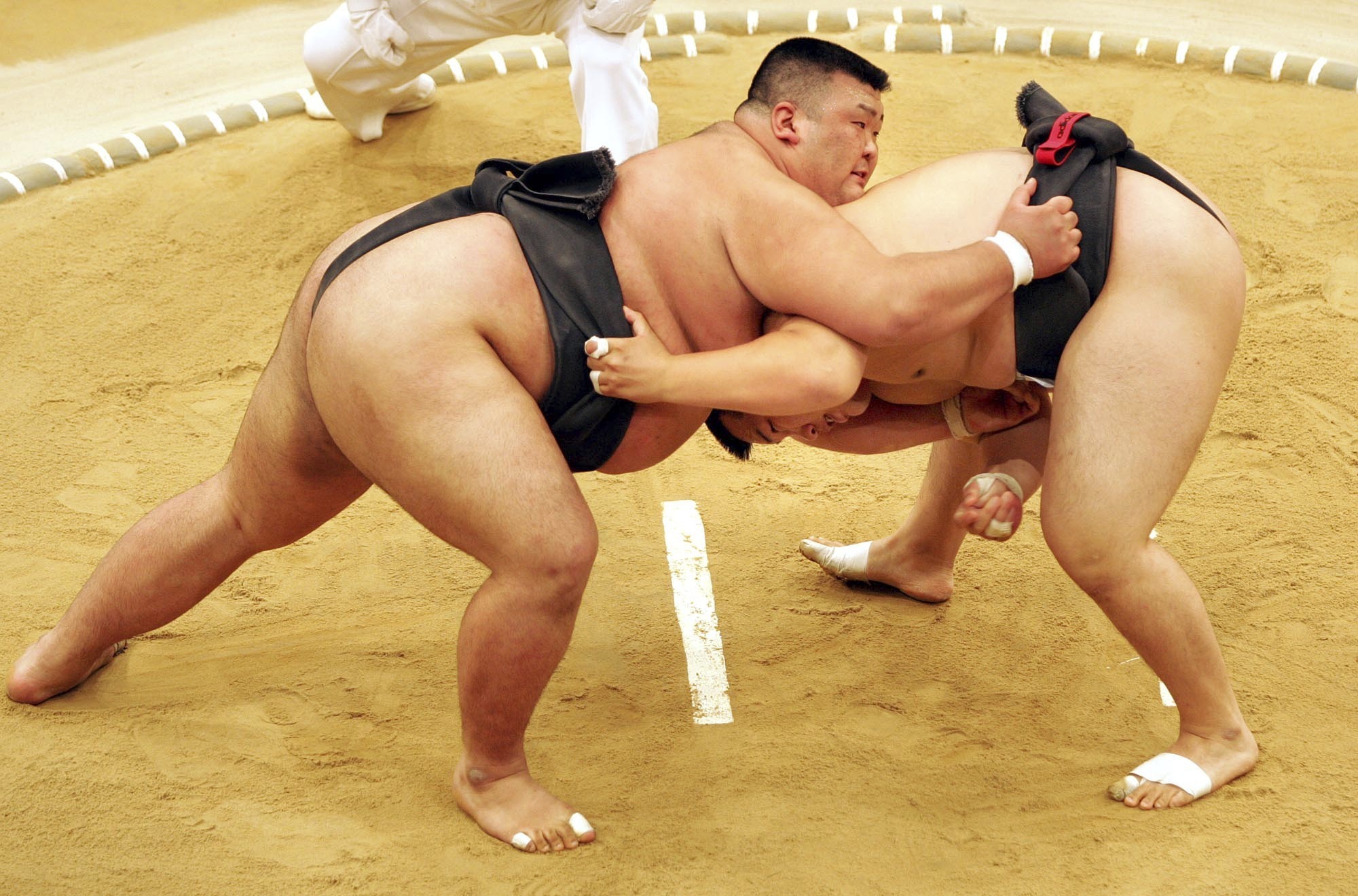 FILE - Sumo wrestler Takayuki Ichihara from Japan, left, fights against Keisho Shimoda from Japan, right, at the heavy weight final of the Sumo tournament within the World Games on July 19, 2005, in Duisburg, Germany. Delayed a year because of the COVID-19 pandemic, the World Games open Thursday, July 7, 2022, in Alabama featuring more than 3,600 athletes participating in non-Olympic events including sumo wrestling, gymnastics, pickleball, martial arts and tug of war. 