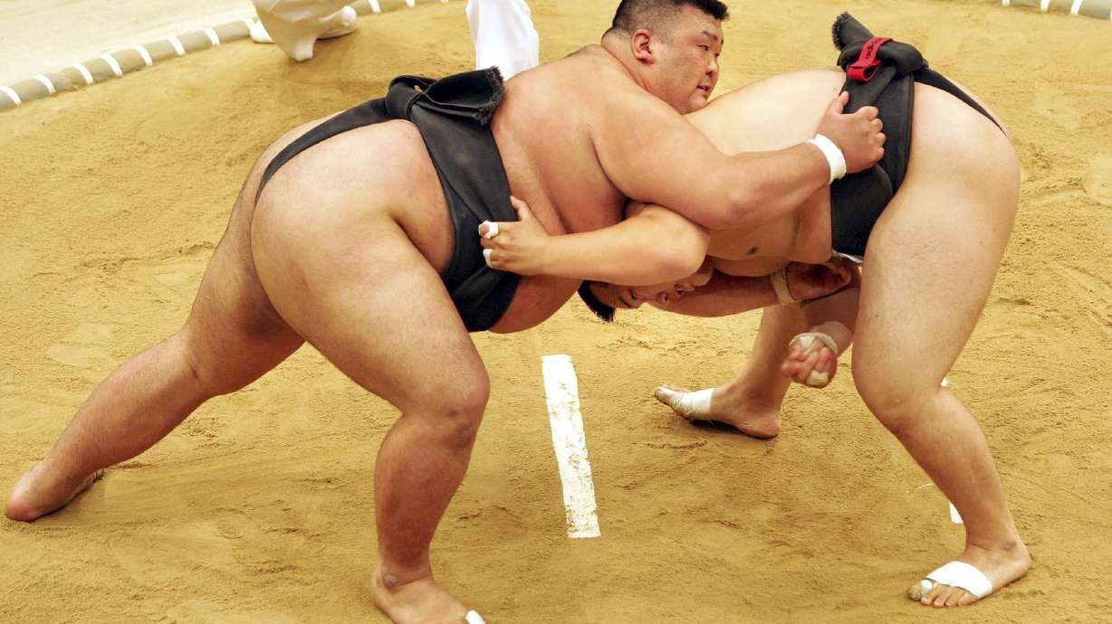 FILE - Sumo wrestler Takayuki Ichihara from Japan, left, fights against Keisho Shimoda from Japan, right, at the heavy weight final of the Sumo tournament within the World Games on July 19, 2005, in Duisburg, Germany. Delayed a year because of the COVID-19 pandemic, the World Games open Thursday, July 7, 2022, in Alabama featuring more than 3,600 athletes participating in non-Olympic events including sumo wrestling, gymnastics, pickleball, martial arts and tug of war.