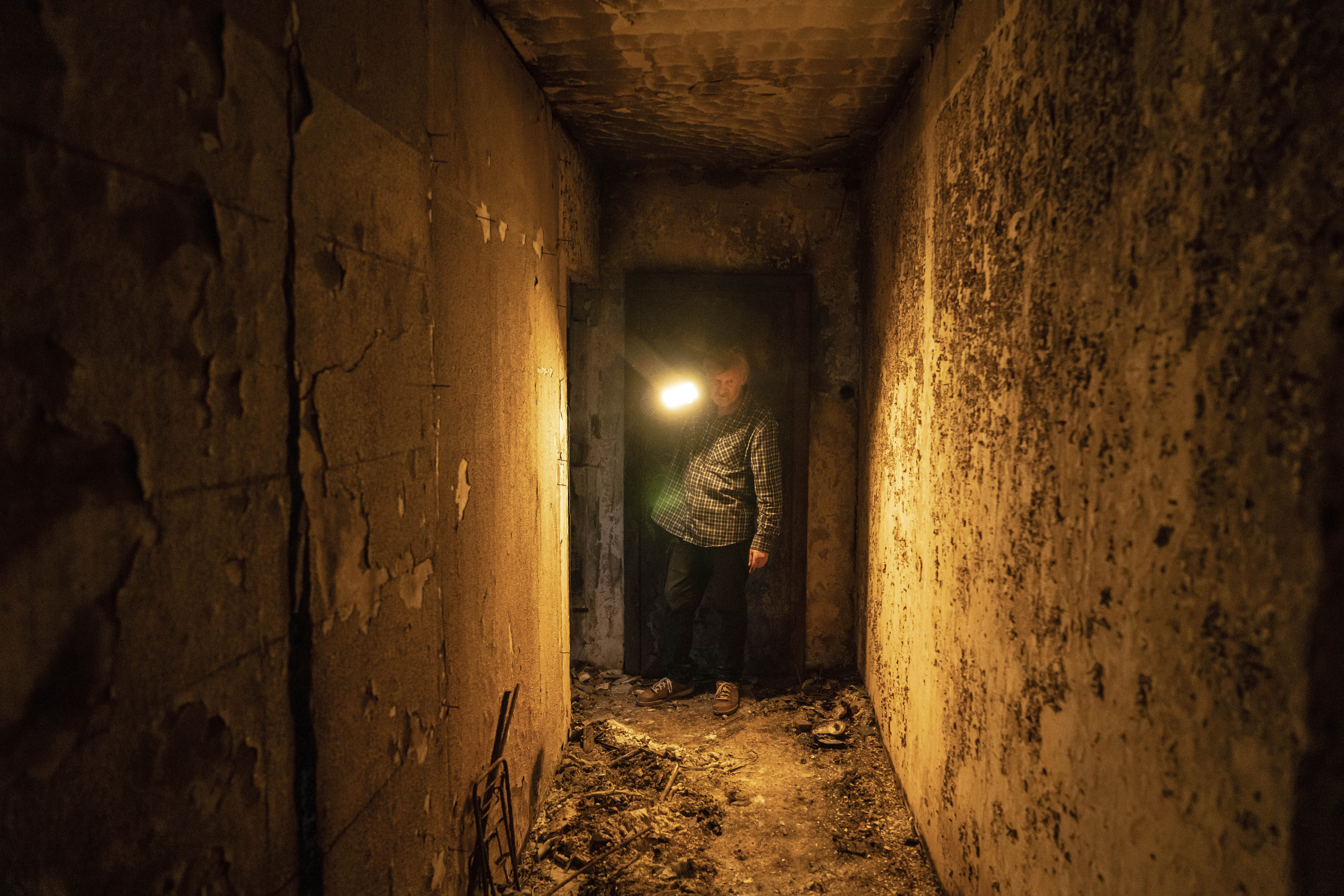 Viktor Shevchenko shows his house which had been damaged in a Russian attack in the Saltivka district in Kharkiv, Ukraine, Friday.