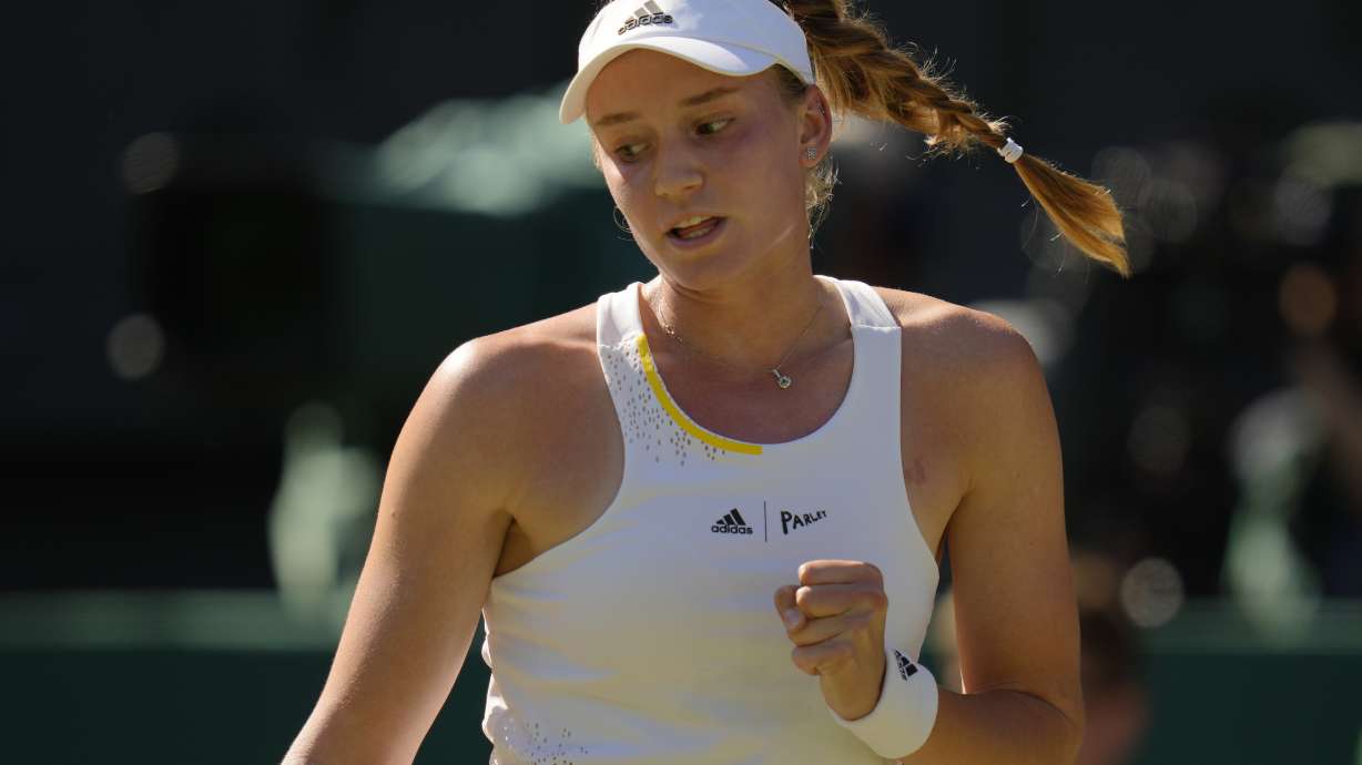 Kazakhstan's Elena Rybakina reacts after winning the first set against Romania's Simona Halep in a women's singles semifinal match on day eleven of the Wimbledon tennis championships in London, Thursday, July 7, 2022.