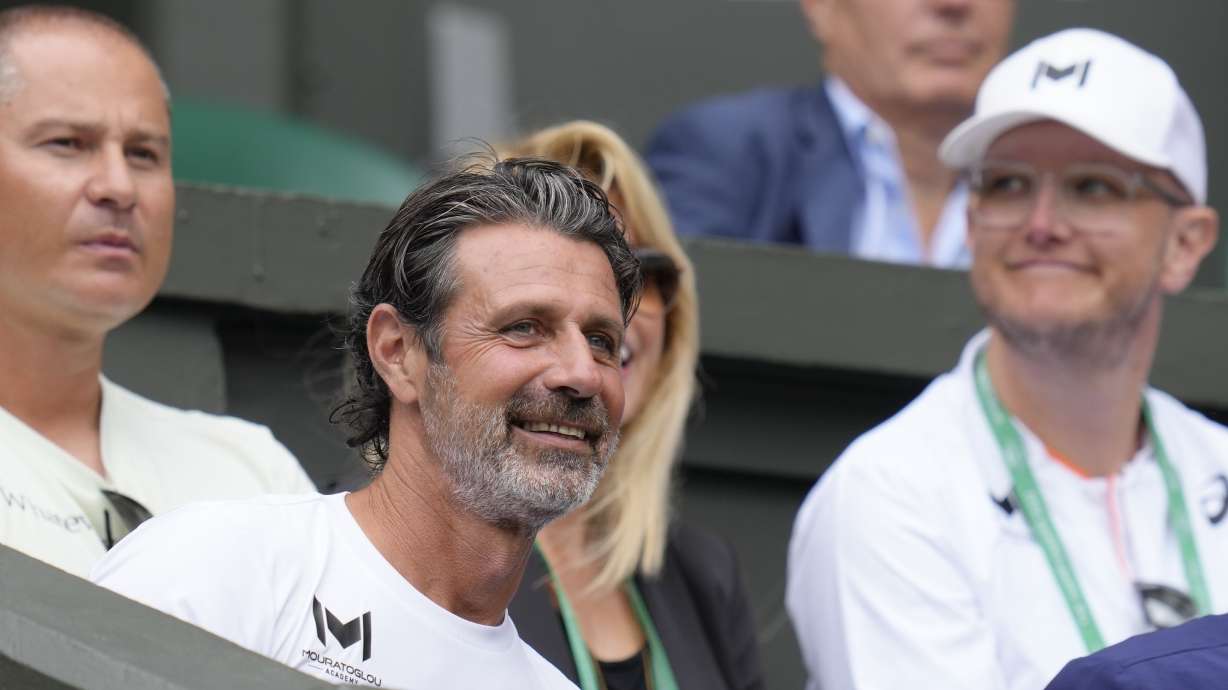 Patrick Mouratoglou, the coach of Romania's Simona Halep sits in the players box for her match against Amanda Anisimova of the US in the women's singles quarterfinals on day ten of the Wimbledon tennis championships in London, Wednesday, July 6, 2022.