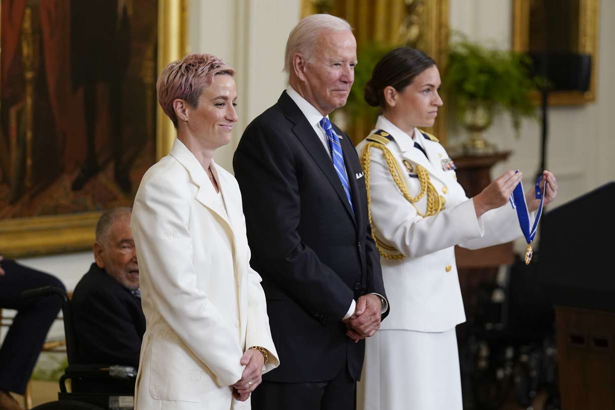 President Joe Biden awards the nation's highest civilian honor, the Presidential Medal of Freedom, to Megan Rapinoe at the White House in Washington, Thursday.