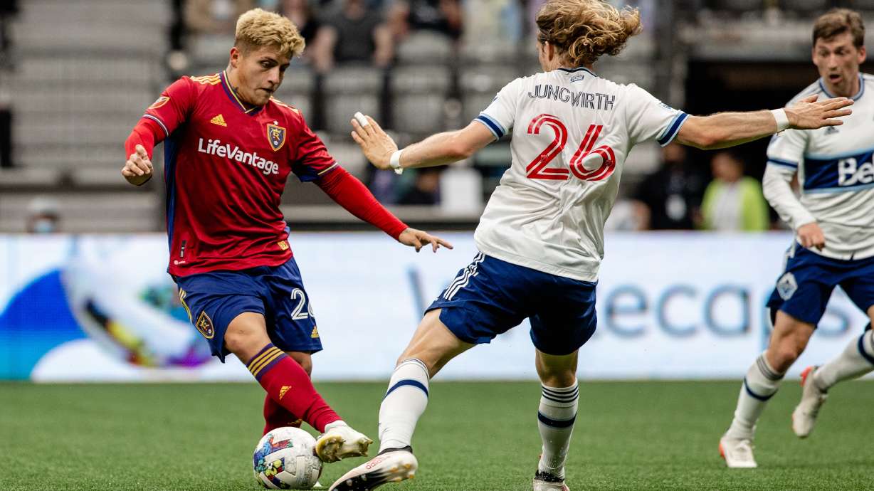 Diego Luna dribbles around a Vancouver defender on June 4.