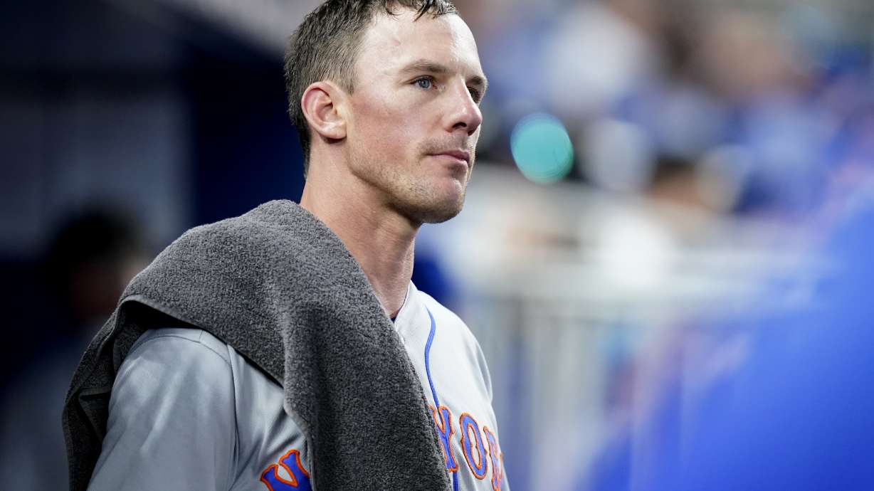 New York Mets starting pitcher Chris Bassitt looks out from the dugout after pitching in the fourth inning of a baseball game against the Miami Marlins, Saturday, June 25, 2022, in Miami. The Marlins scored two runs in the inning.
