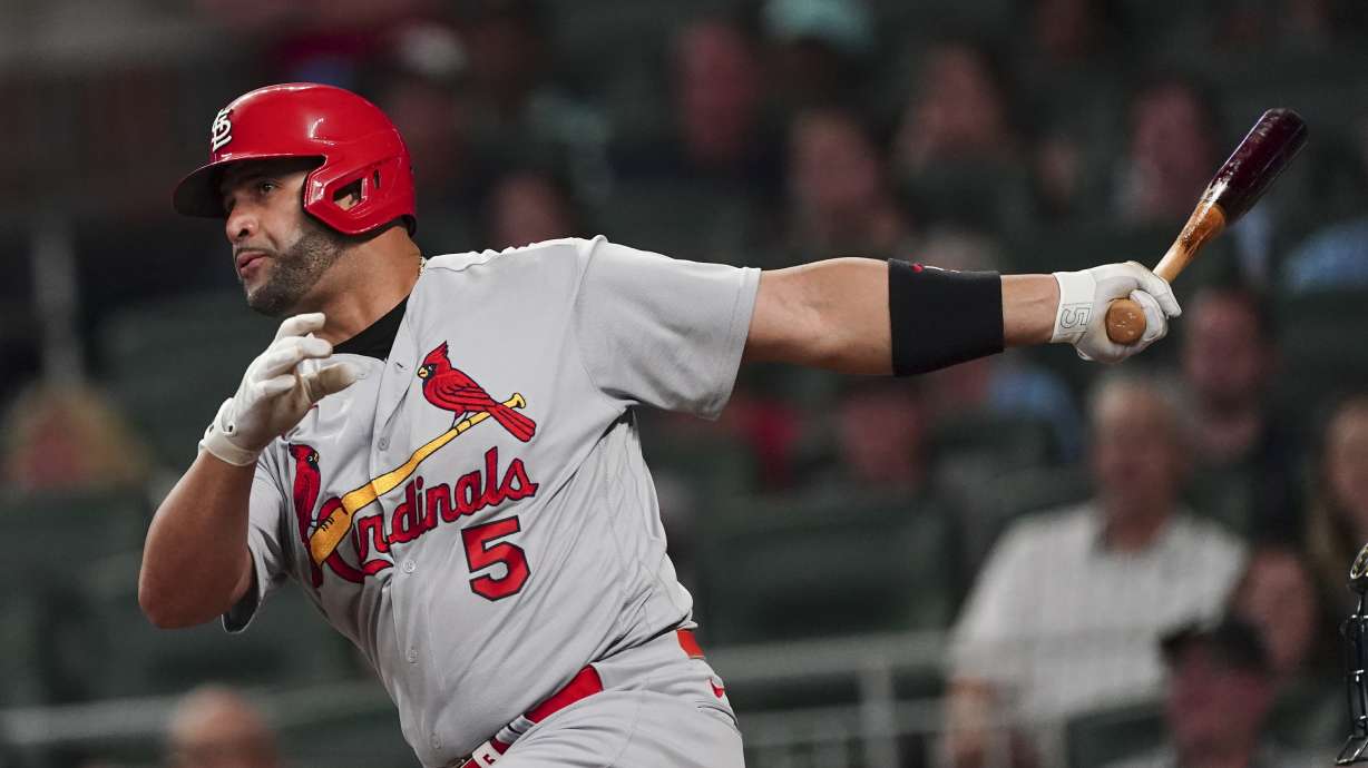 St. Louis Cardinals pinch hitter Albert Pujols drives in a run with a sacrifice fly in the seventh inning of a baseball game against the Atlanta Braves, Thursday, July 7, 2022, in Atlanta.