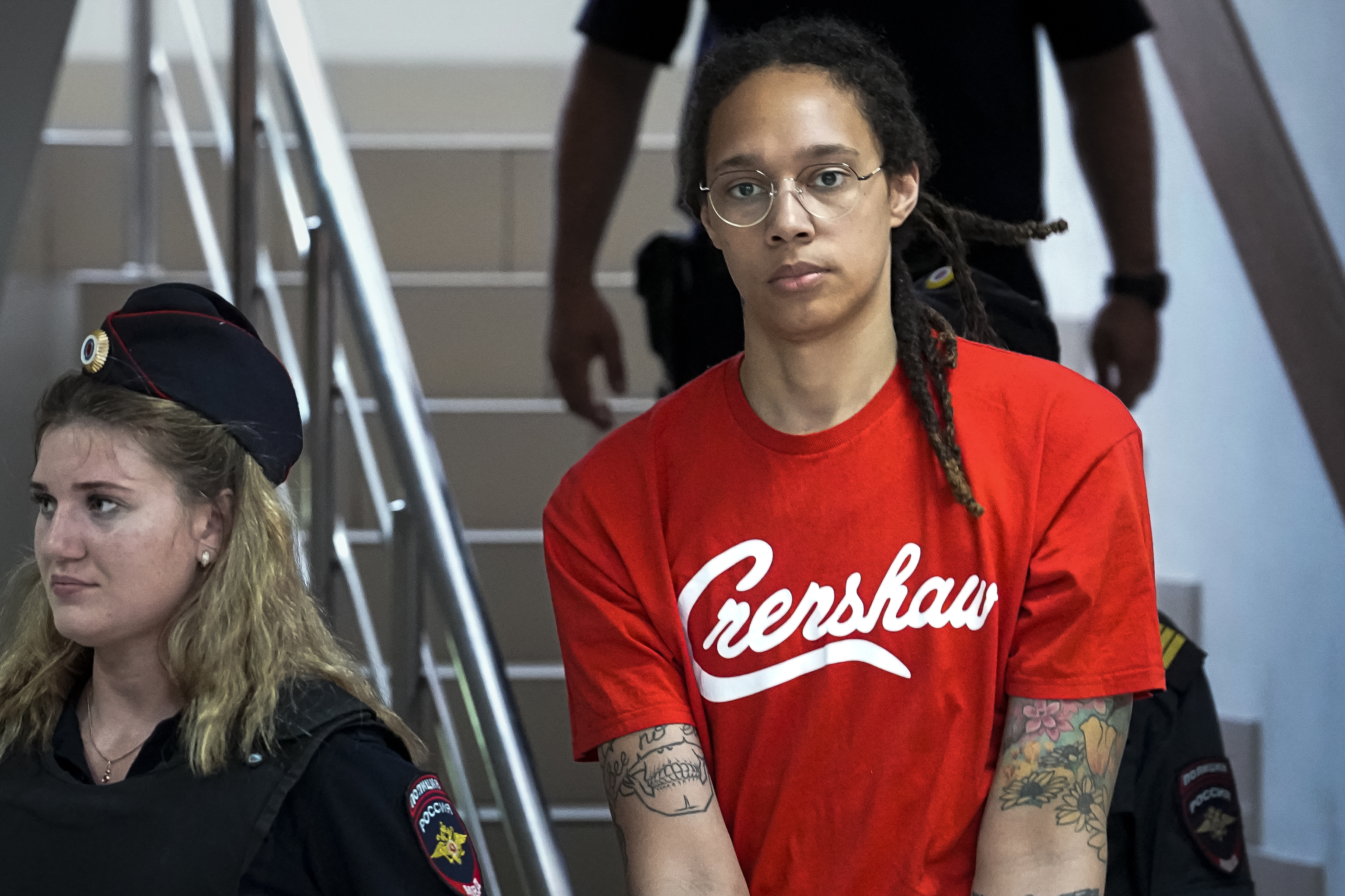 WNBA star and two-time Olympic gold medalist Brittney Griner is escorted to a courtroom for a hearing, in Khimki just outside Moscow, Russia, Thursday, July 7, 2022. Griner pleaded guilty Thursday to drug possession charges on the second day of her trial in a Russian court in a case that could see her sentenced to up to 10 years in prison. 