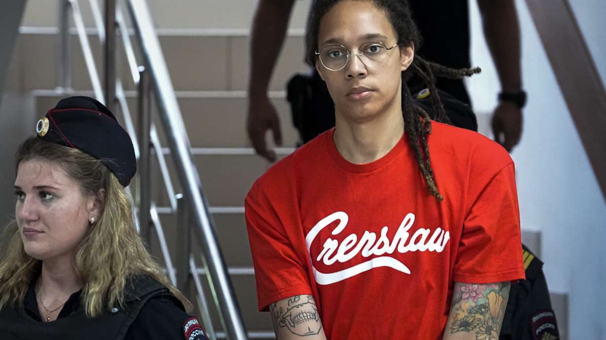 WNBA star and two-time Olympic gold medalist Brittney Griner is escorted to a courtroom for a hearing, in Khimki just outside Moscow, Russia, Thursday, July 7, 2022. Griner pleaded guilty Thursday to drug possession charges on the second day of her trial in a Russian court in a case that could see her sentenced to up to 10 years in prison.