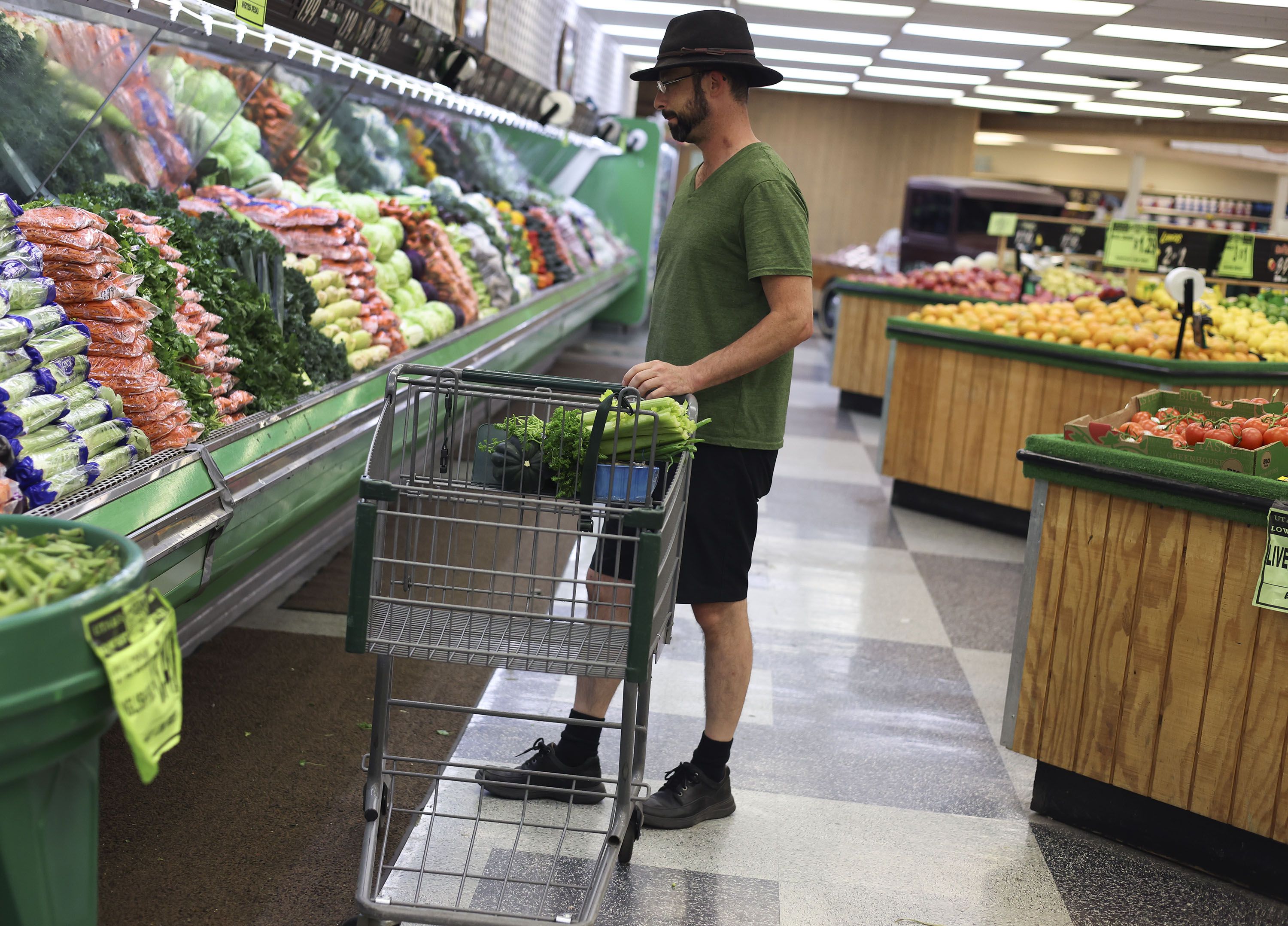 Morgan Smith, of Logan, purchases vegetables at Reams in Sandy on Thursday. With food shortages hitting recent headlines, you may be wondering how to keep your pantry stocked. The Utah Department of Public Safety says that the best thing to do to avoid shortages is to not panic.