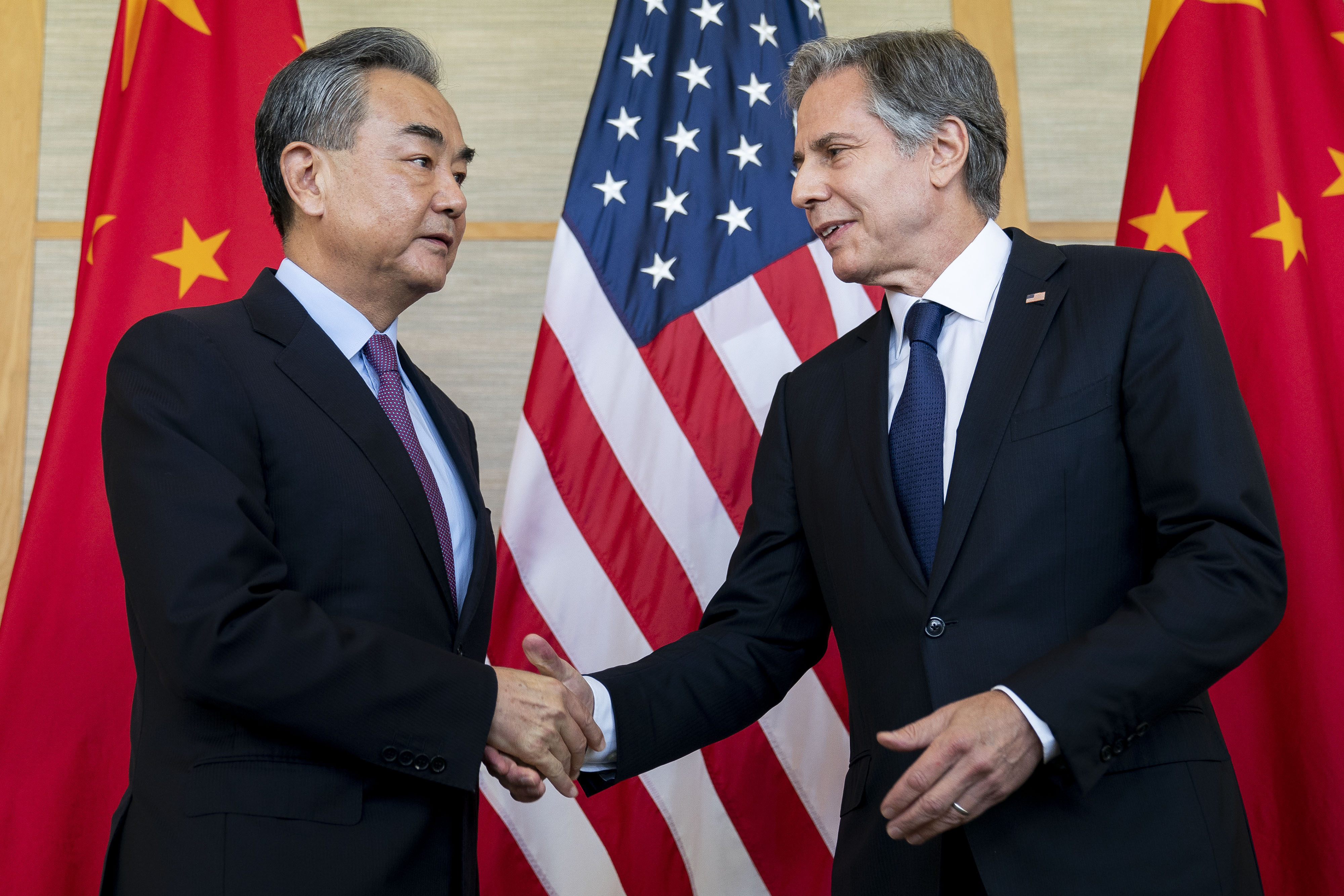 U.S. Secretary of State Antony Blinken, right, shakes hands with China's Foreign Minister Wang Yi during a meeting in Nusa Dua on the Indonesian resort island of Bali, Saturday.