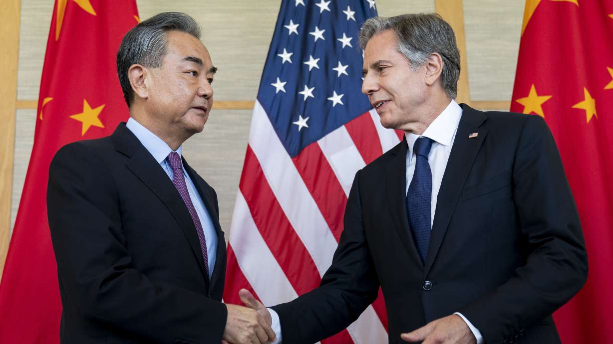 U.S. Secretary of State Antony Blinken, right, shakes hands with China's Foreign Minister Wang Yi during a meeting in Nusa Dua on the Indonesian resort island of Bali, Saturday.