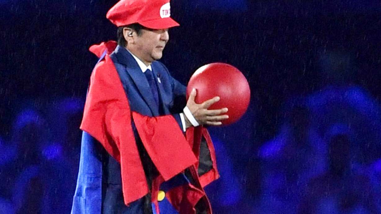 FILE - Then Japanese Prime Minister Shinzo Abe appears as the Nintendo game character Super Mario during the closing ceremony at the 2016 Summer Olympics in Rio de Janeiro, Brazil on Aug. 21, 2016. Despite his fame as a Japan's longest serving prime minister, Shinzo Abe might have had enjoyed his biggest moment at the closing ceremony of the 2016 Rio de Janeiro.