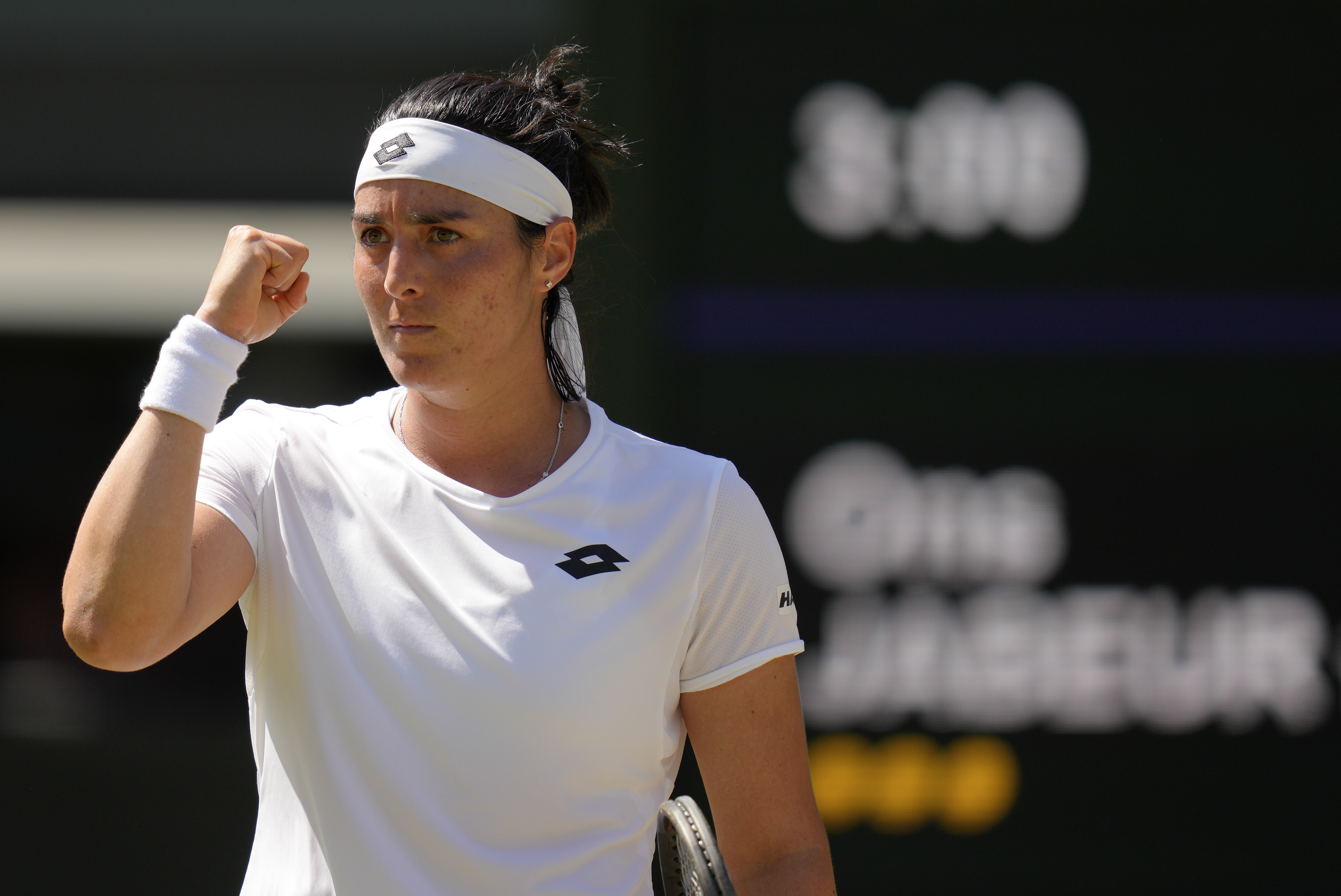 Tunisia's Ons Jabeur celebrates winning a point against Germany's Tatjana Maria in a women's singles semifinal match on day eleven of the Wimbledon tennis championships in London, Thursday, July 7, 2022. 