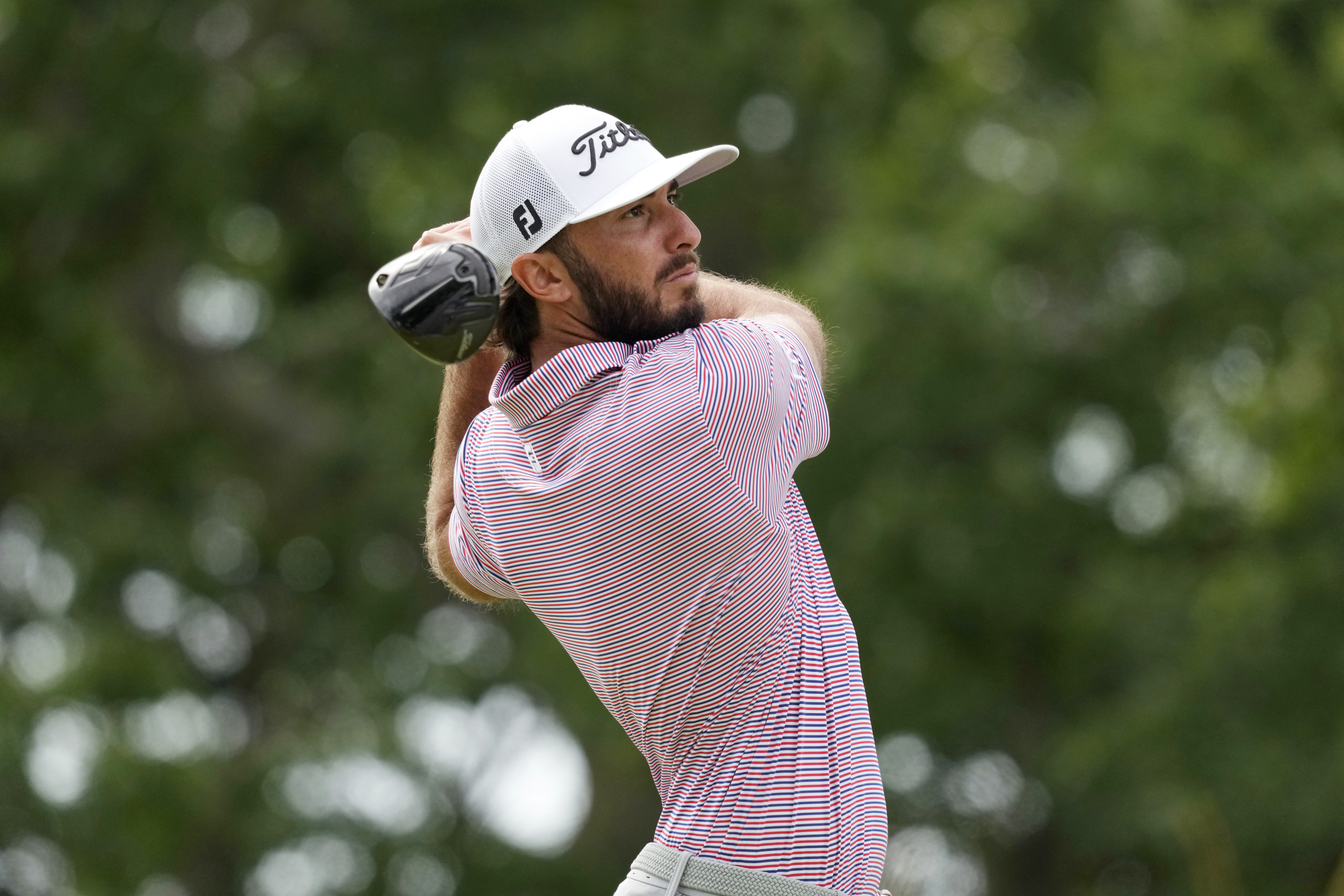 Max Homa watches his shot on the 10th hole during the first round of the U.S. Open golf tournament at The Country Club, Thursday, June 16, 2022, in Brookline, Mass.
