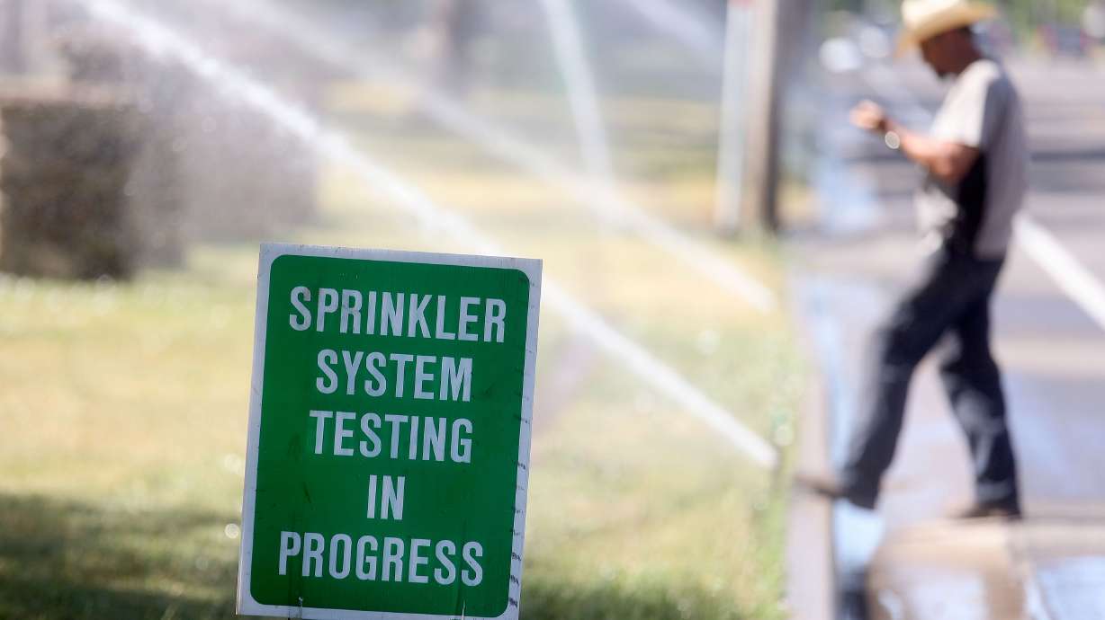 Gary Petit with Salt Lake City’s Public Lands Department repairs sprinklers in Liberty Park on July 7, 2022. Utah lawmakers are looking to improve conservation after a report outlined rising consumption trends in the Great Salt Lake basin.