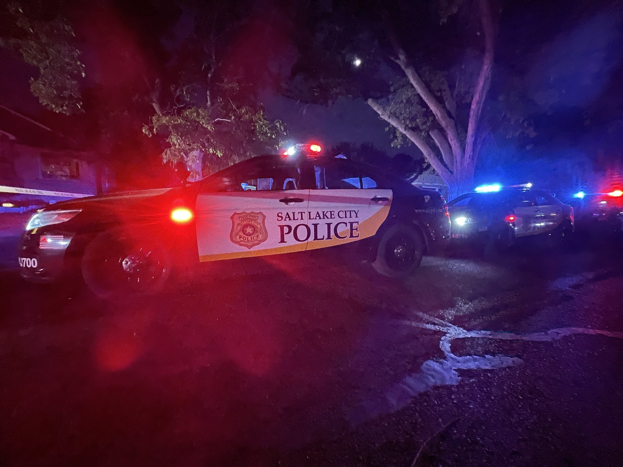 A man was hospitalized Saturday night after police say he pointed a gun at them from inside his home as "smoke billowed from his yard."
