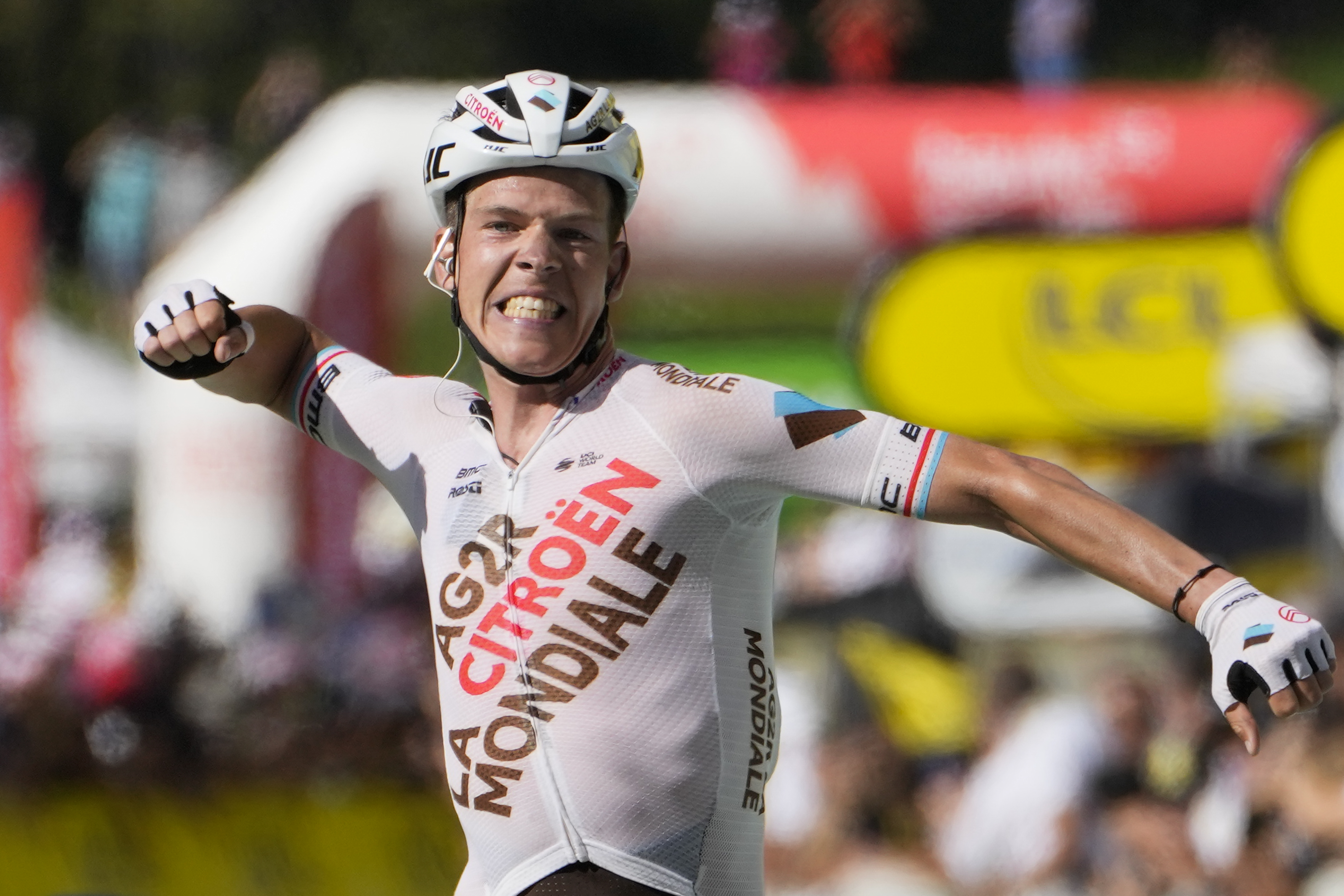 Stage winner Luxembourg's Bob Jungels celebrates as he crosses the finish line during the ninth stage of the Tour de France cycling race over 193 kilometers (119.9 miles) with start in Aigle, Switzerland and finish in Chatel les Portes du Soleil, France, Sunday, July 10, 2022. 