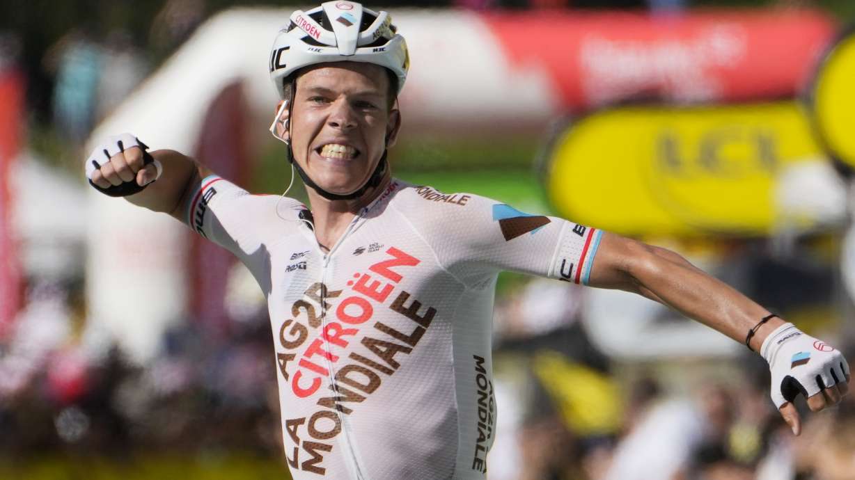 Stage winner Luxembourg's Bob Jungels celebrates as he crosses the finish line during the ninth stage of the Tour de France cycling race over 193 kilometers (119.9 miles) with start in Aigle, Switzerland and finish in Chatel les Portes du Soleil, France, Sunday, July 10, 2022.