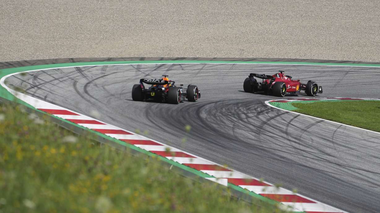 Ferrari driver Charles Leclerc, right, of Monaco, steers his car followed by Red Bull driver Max Verstappen, of the Netherlands, during the Austrian F1 Grand Prix at the Red Bull Ring racetrack in Spielberg, Austria, Sunday, July 10, 2022.