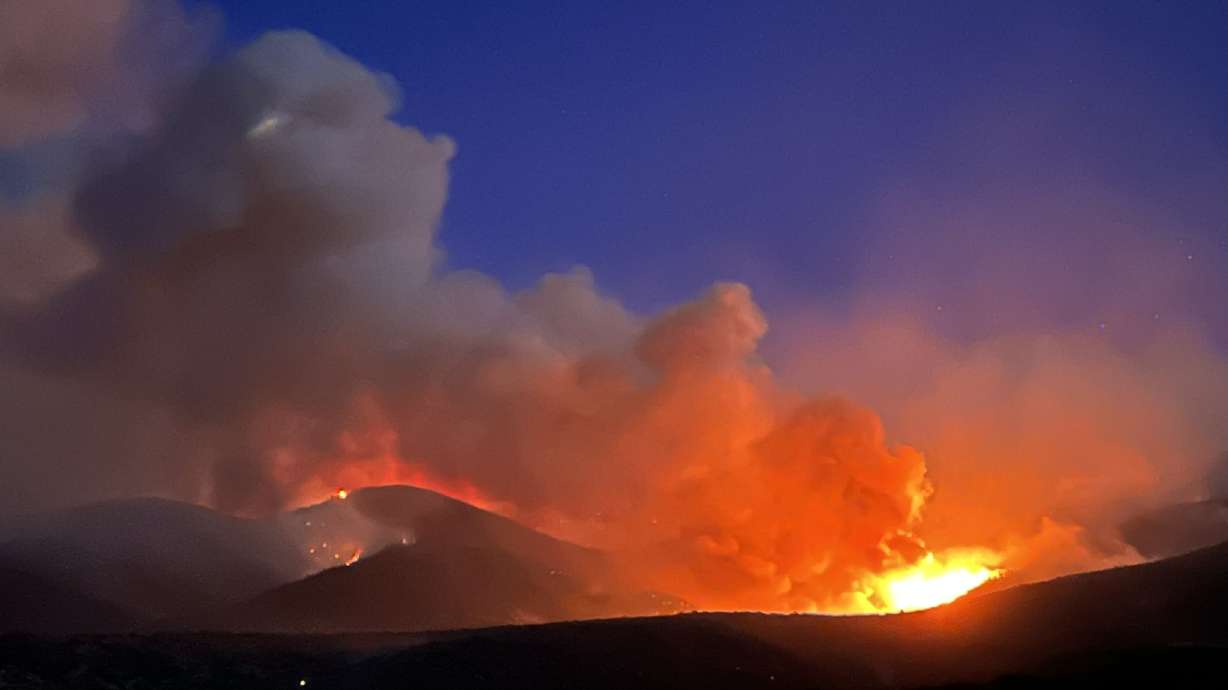 The Halfway Hill Fire in Fillmore burns on Saturday. Four people were arrested Saturday after police say they abandoned a fire that could have started the wildfire.